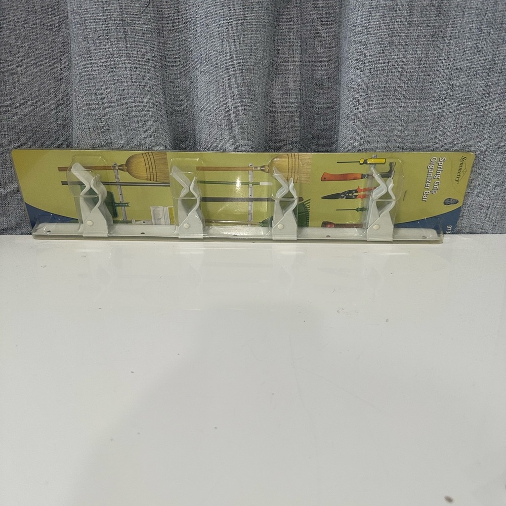 Symmetry spring grip Wall Organizer with White Holders. NWT.
